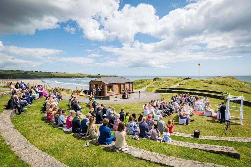 Guests are watching an Inchydoney Lodge and Spa Outdoor Wedding Ceremony