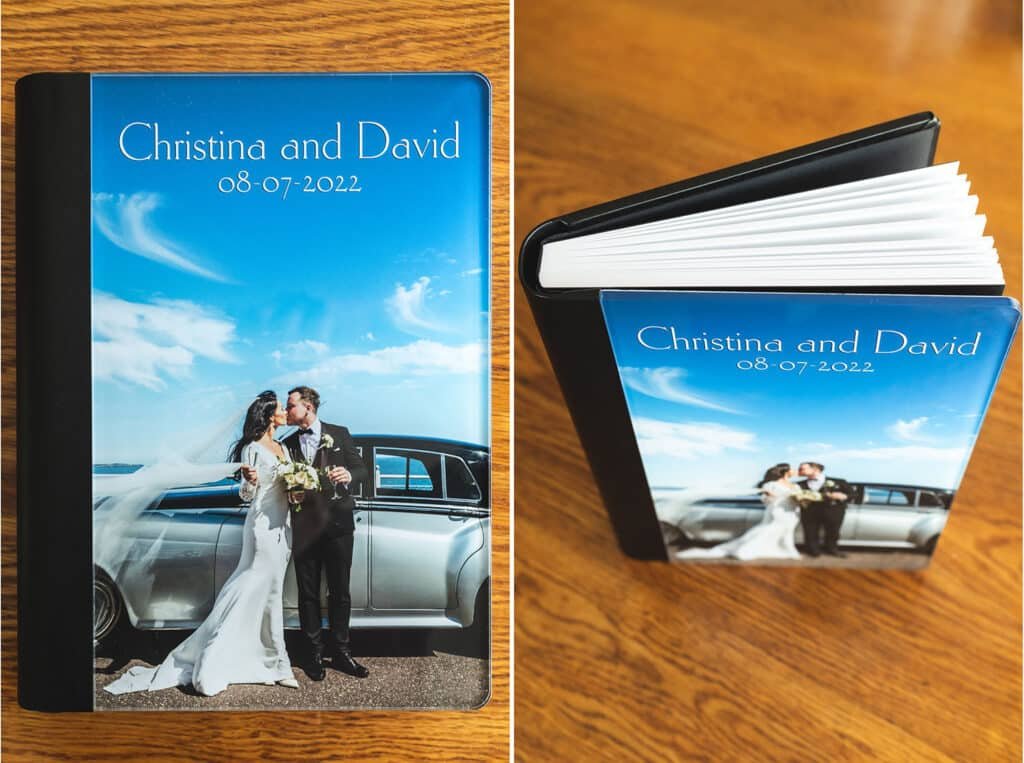 A Deluxe Wedding Album Cover on a shiny wooden table