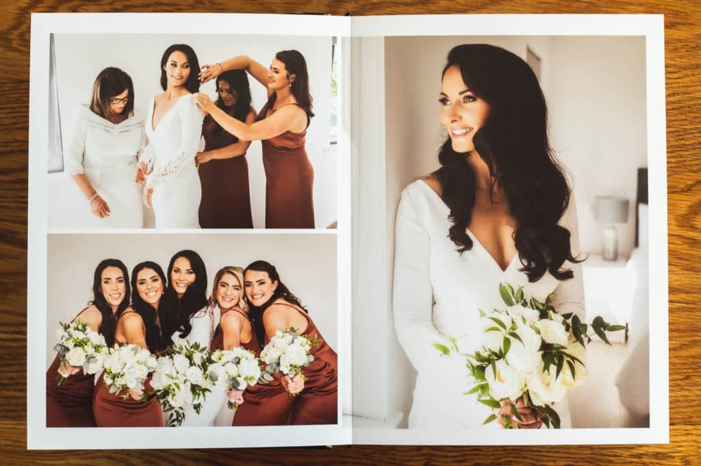 A Graphistudio Deluxe Wedding Album Double Page Spread with three photographs lying on a table